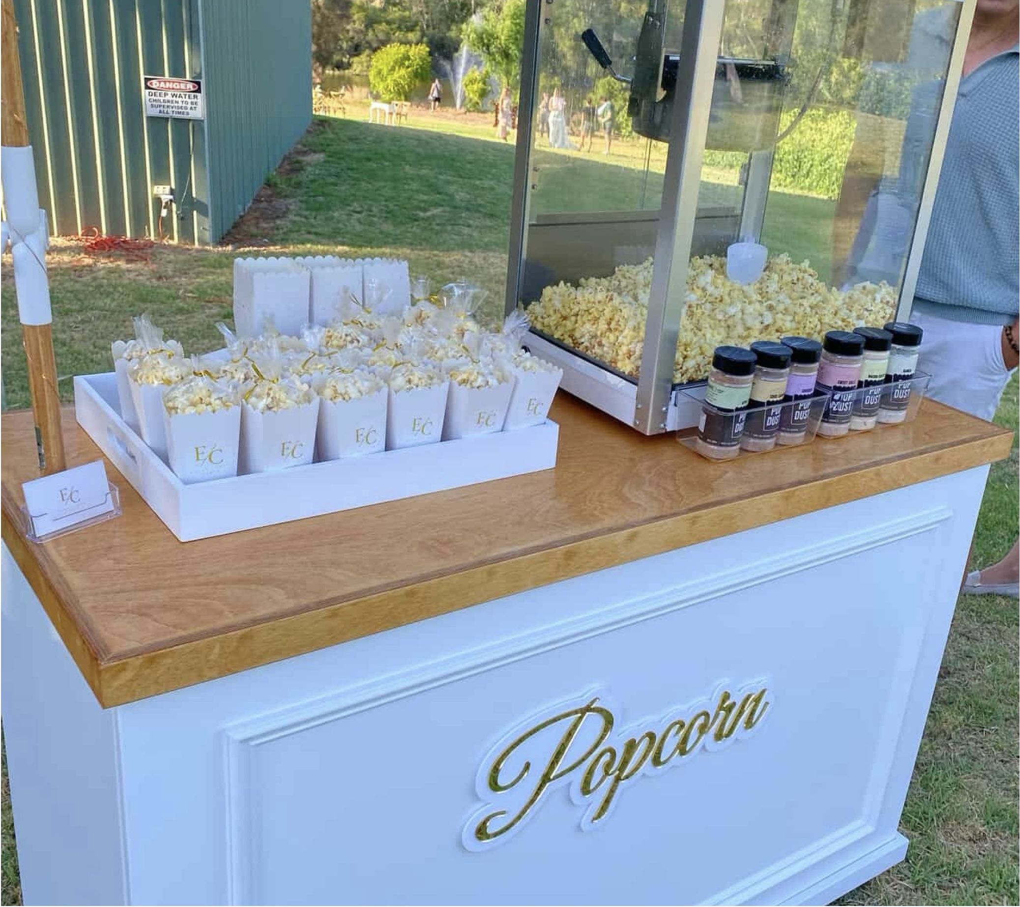 Popcorn cart with branded EC bags, popcorn machine, gourmet flavour dusts and gold lettering