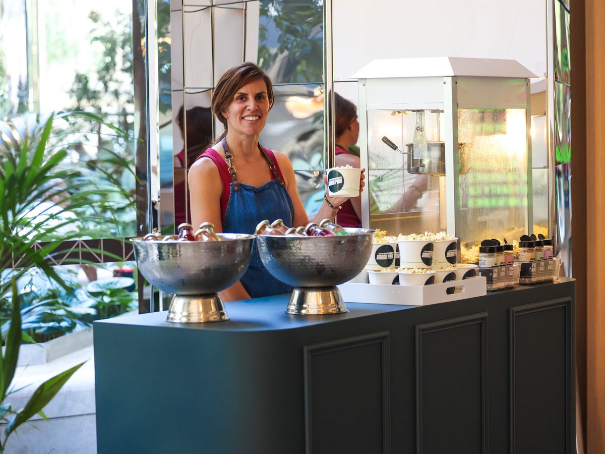 Dark teal event cart at a corporate function