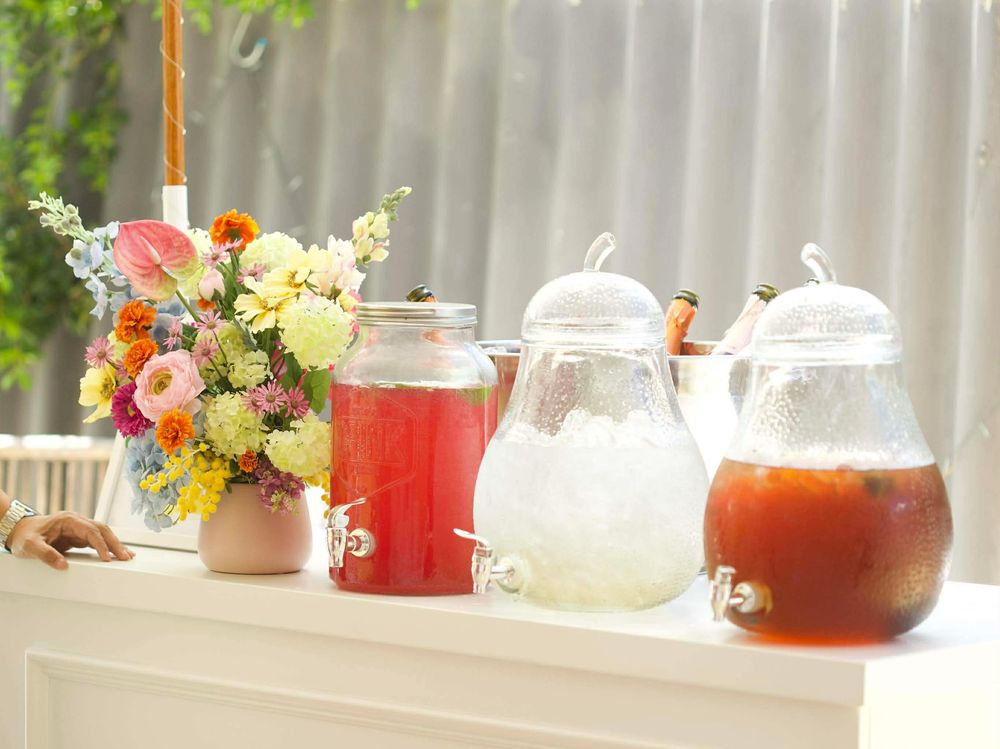 Close-up of tiered sweet treats display with cakes and macarons